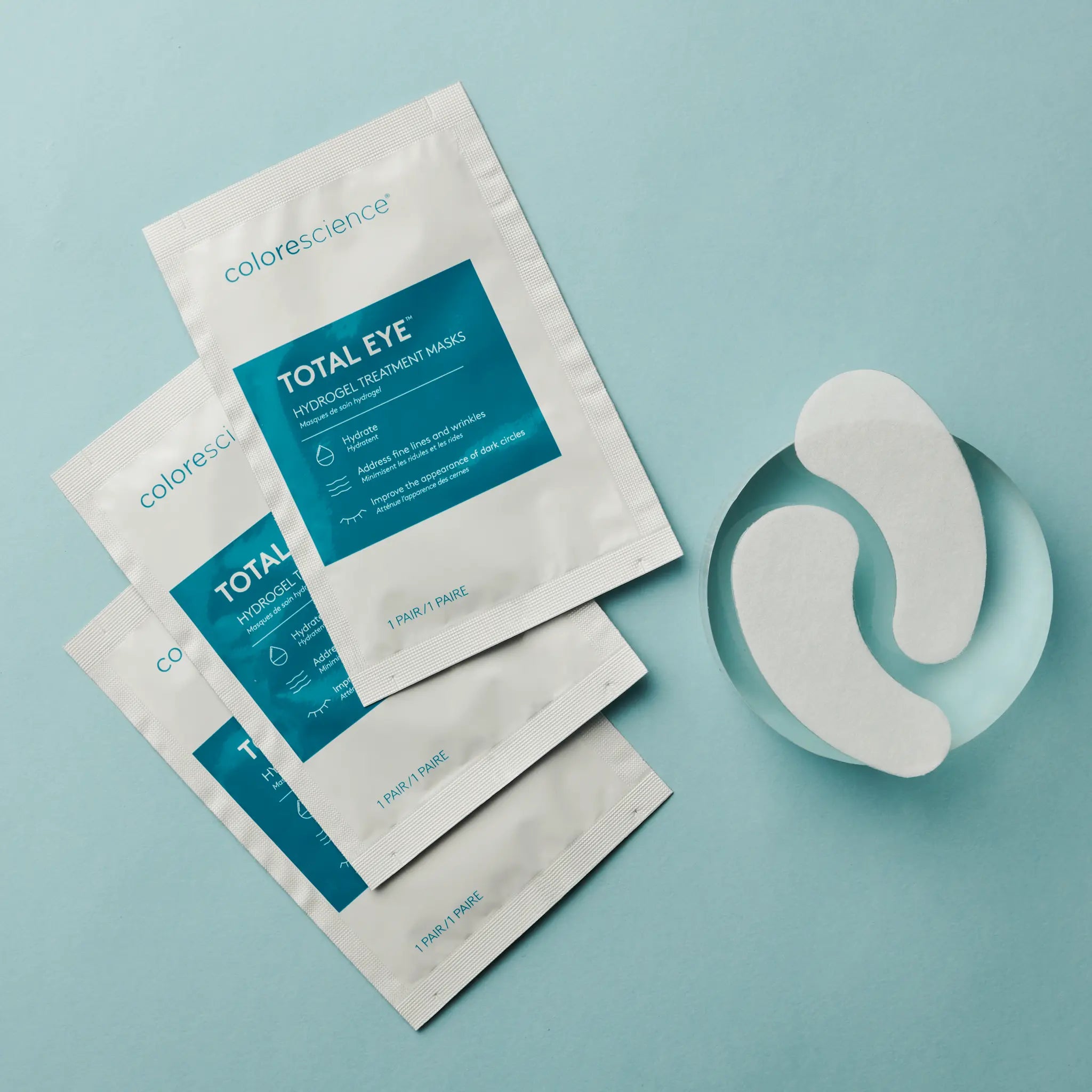 total eye hydrogel masks in packaging and one paid of mask outside of packaging || all