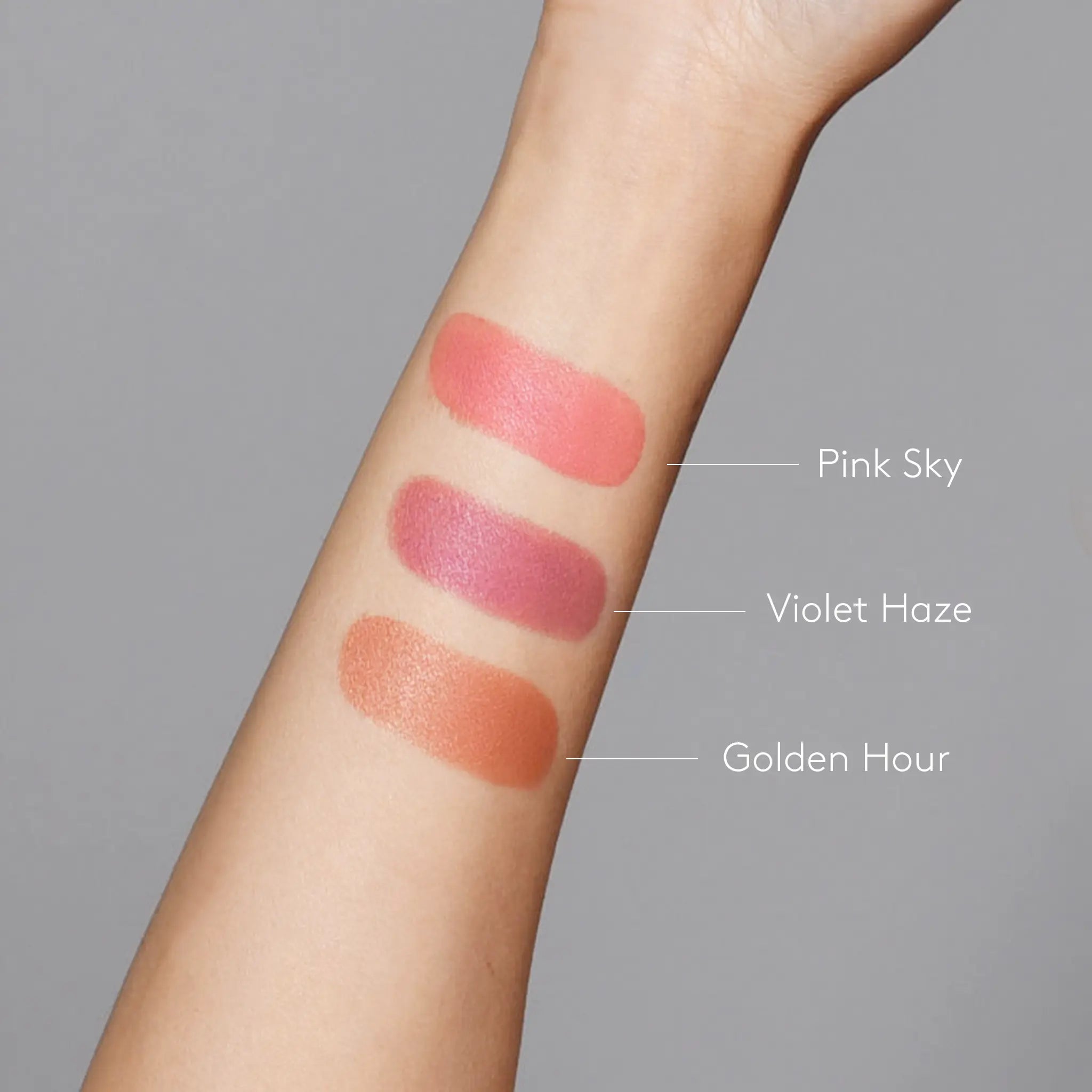 Sunforgettable® Total Protection™ Color Balm SPF 50 Pink Sky, Violet Haze, and Golden Hour swatches on fair skintone arm || all